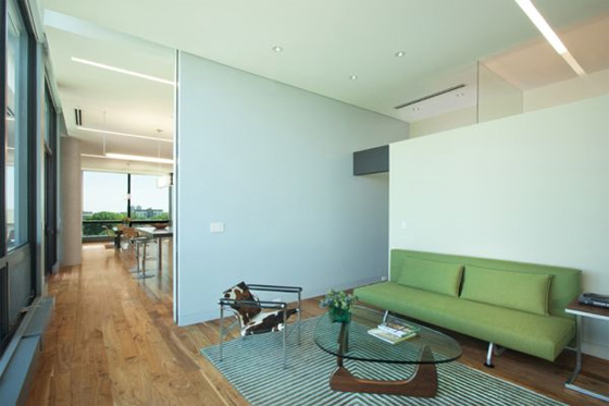 Living Room with Green Chair by ALTUS Architecture Penthouse Interior Design by ALTUS Architecture